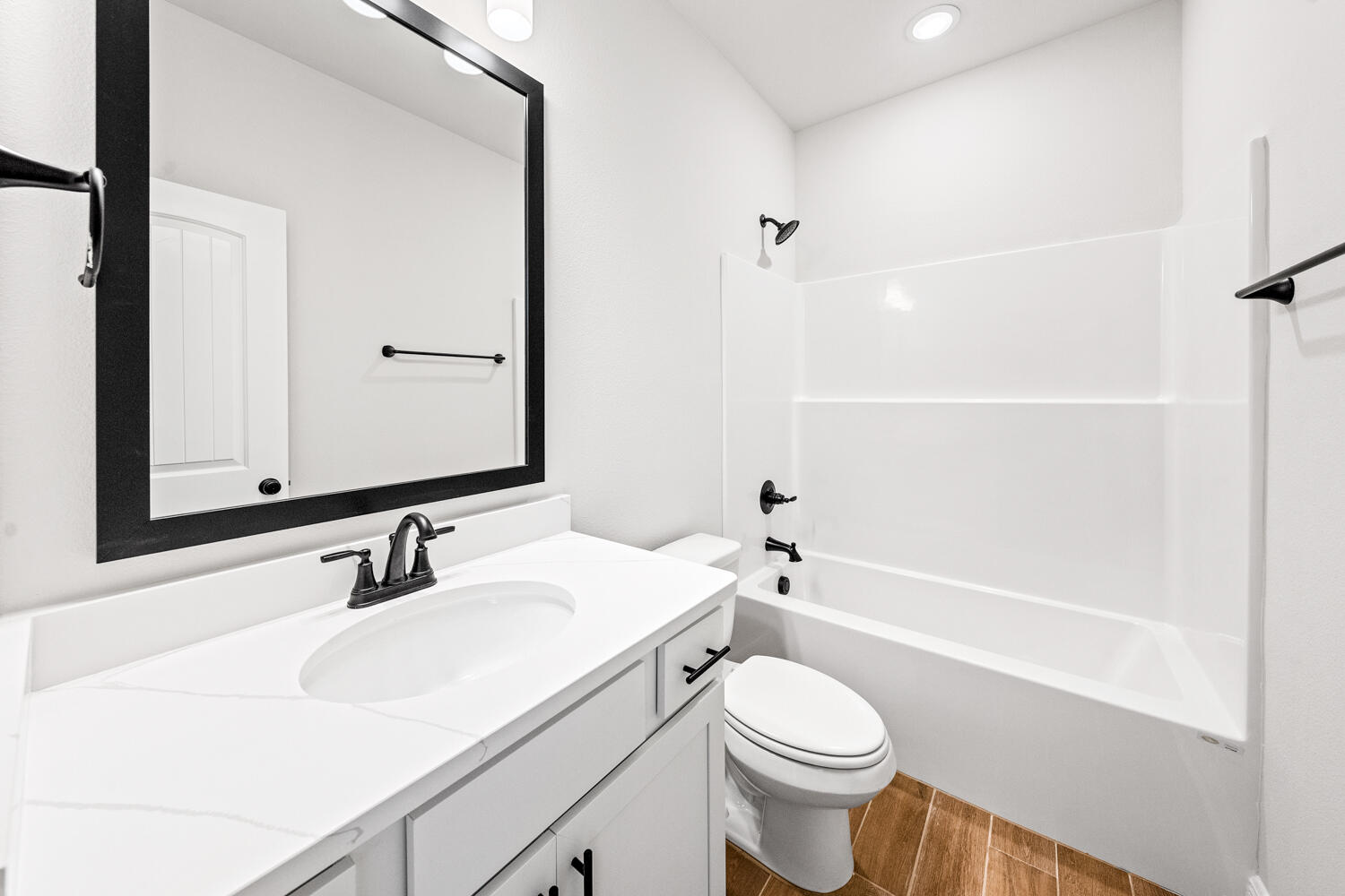 232 West Tweet Street Freeport, FL 32439 - Photo 19 of 23 a bathroom with a sink a toilet and shower