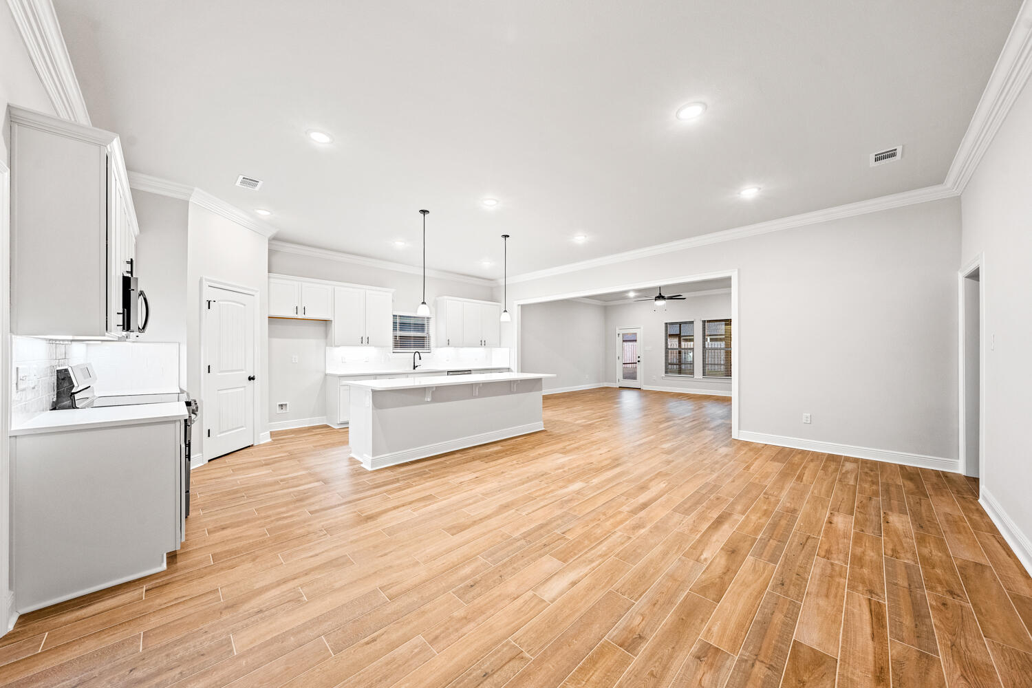 232 West Tweet Street Freeport, FL 32439 - Photo 6 of 23 a view of kitchen with wooden floor and electronic appliances