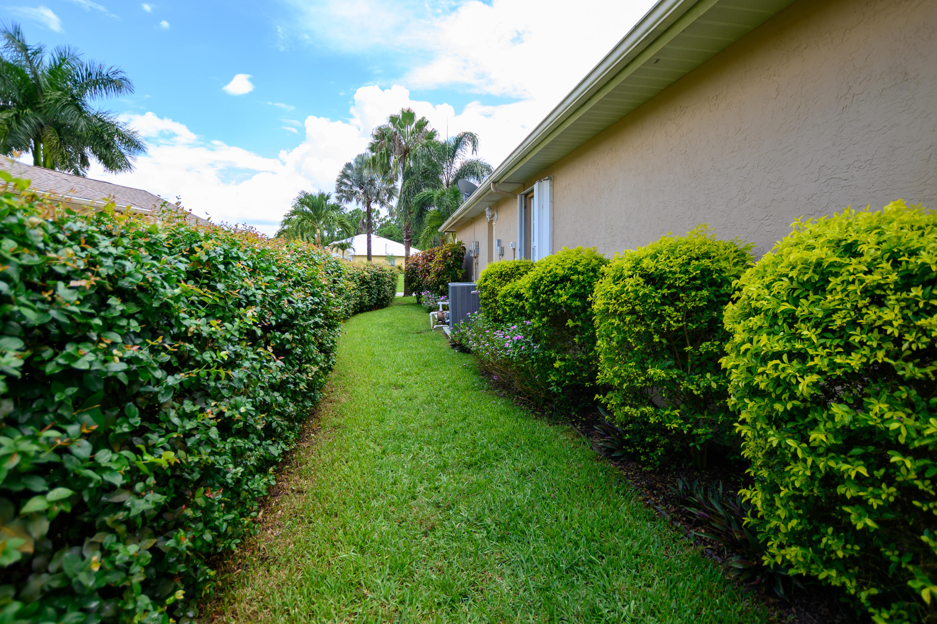 1585 Southwest Flagami Road Port St. Lucie, FL 34953 - Photo 19 of 23 EAST SIDE/HOUSE