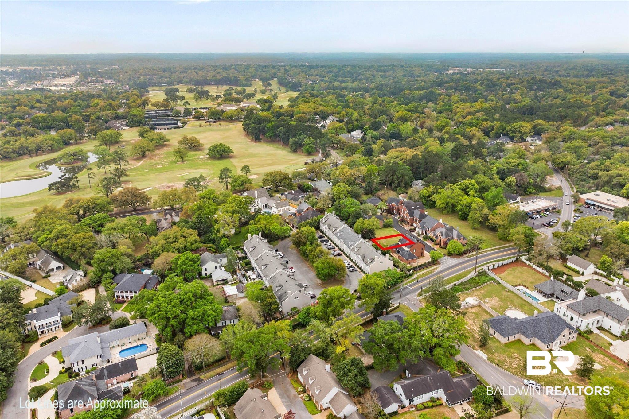 0 Fielding Place Mobile, AL 36608 - Photo 2 of 18 Aerial perspective of suburban area with a large body of water, a local golf course, and property boundaries highlighted