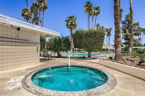 a view of a swimming pool with a sitting area