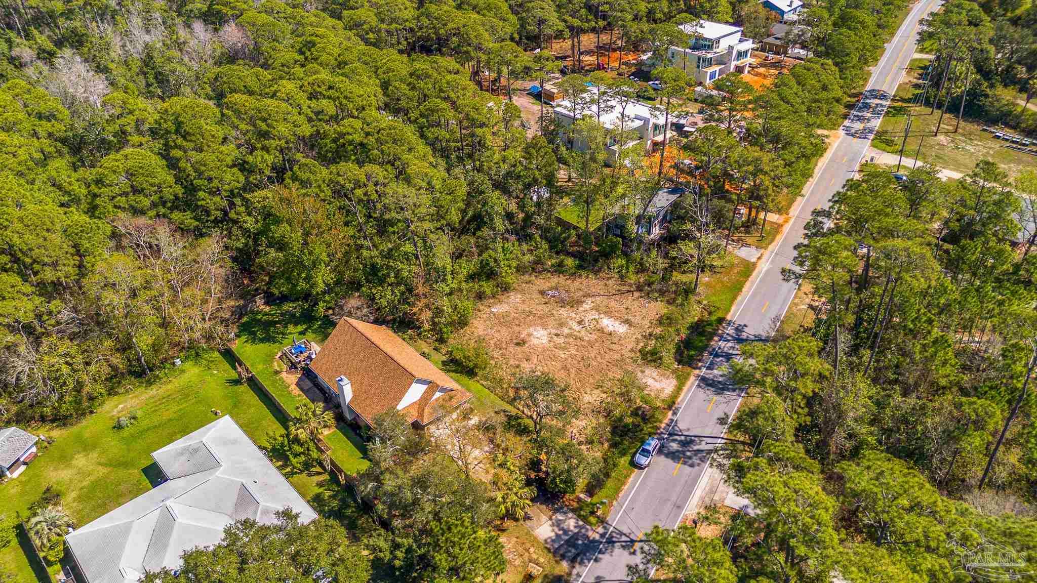 Soundside Drive Gulf Breeze, FL 32563 - Photo 16 of 16 an aerial view of residential house with outdoor space and trees all around