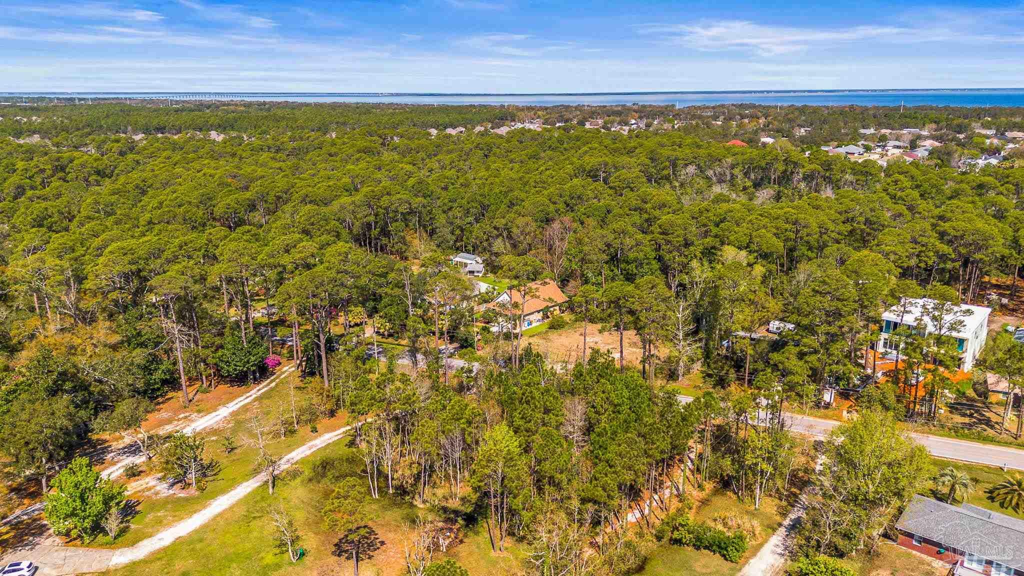 Soundside Drive Gulf Breeze, FL 32563 - Photo 4 of 16 a view of a yard with an outdoor space