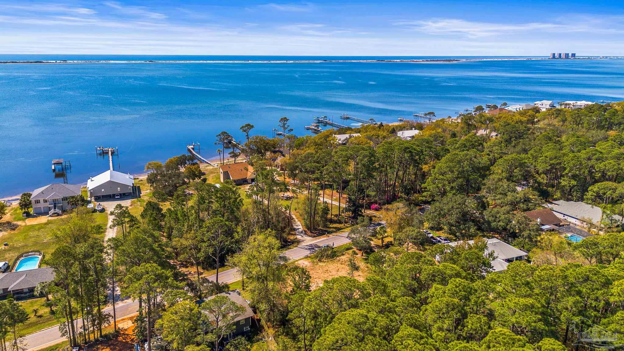 Soundside Drive Gulf Breeze, FL 32563 - Photo 9 of 16 a view of a large body of water with lots of trees