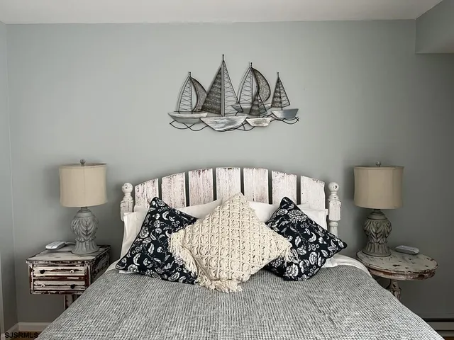 a bedroom with a bed and a lamp on table