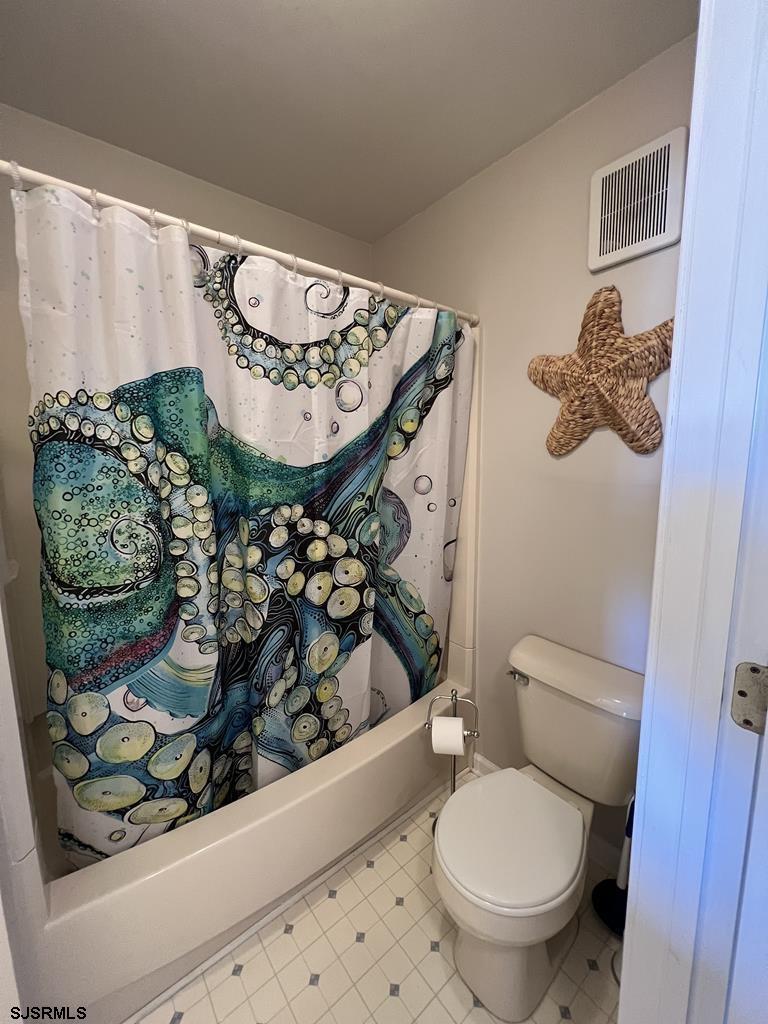 330 42nd Street South, Unit B15 Brigantine, NJ 08203 - Photo 16 of 21 a bathroom with a toilet and a shower