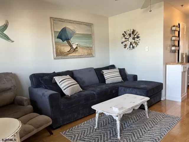 a living room with furniture and a rug