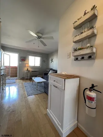 a view of kitchen with cabinets and wooden floor