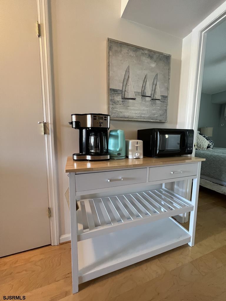 330 42nd Street South, Unit B15 Brigantine, NJ 08203 - Photo 10 of 21 a living room with furniture and a fireplace
