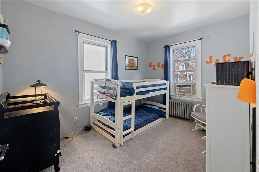 25 89th Street Brooklyn, NY 11209 - Photo 11 of 20 a bedroom with furniture and a window
