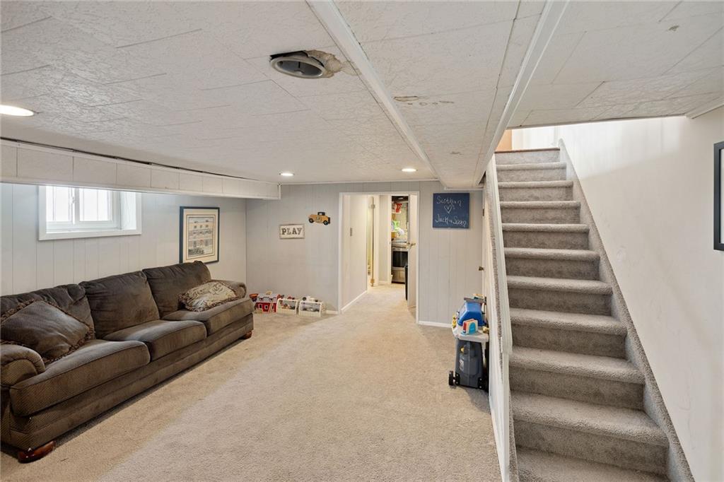 25 89th Street Brooklyn, NY 11209 - Photo 14 of 20 a living room with furniture and a ceiling fan