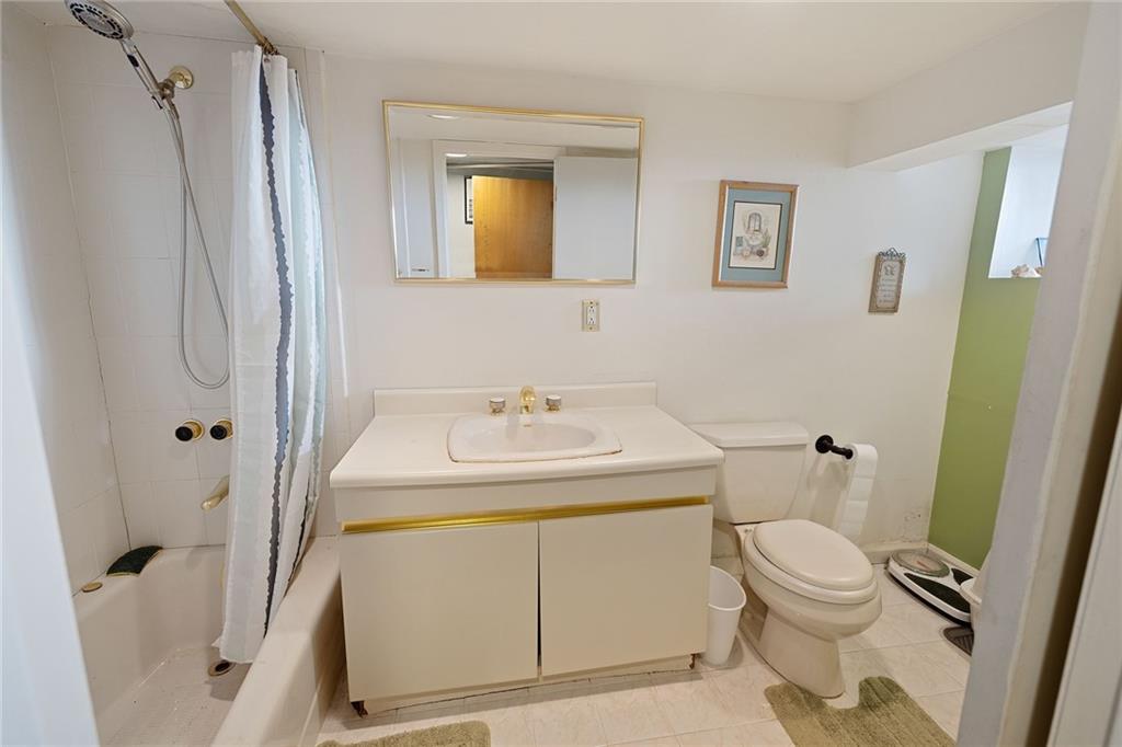 25 89th Street Brooklyn, NY 11209 - Photo 15 of 20 a bathroom with a sink toilet and shower