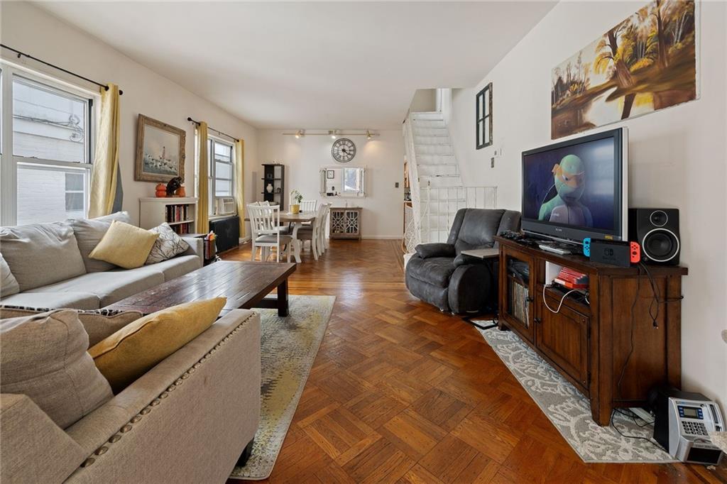 25 89th Street Brooklyn, NY 11209 - Photo 4 of 20 a living room with furniture and a flat screen tv