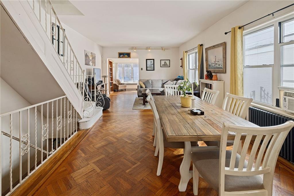25 89th Street Brooklyn, NY 11209 - Photo 5 of 20 a view of a dining room and livingroom with lots of furniture wooden floor and a rug