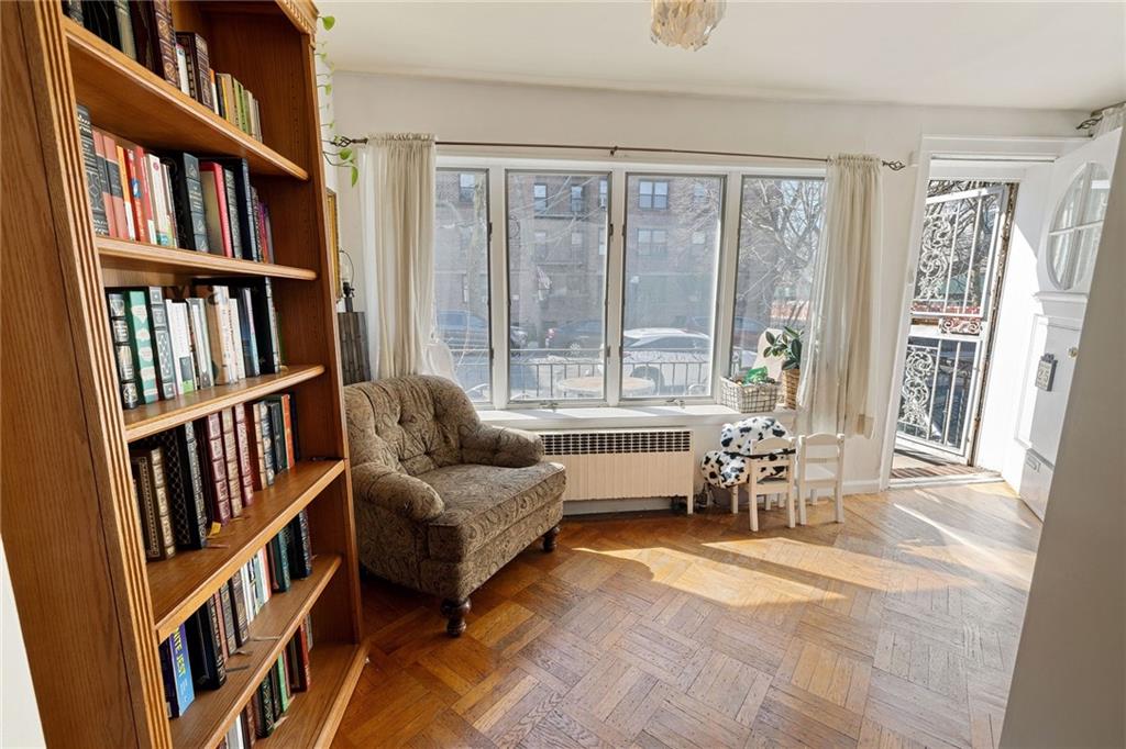 25 89th Street Brooklyn, NY 11209 - Photo 6 of 20 a living room with a book shelf and a book shelf