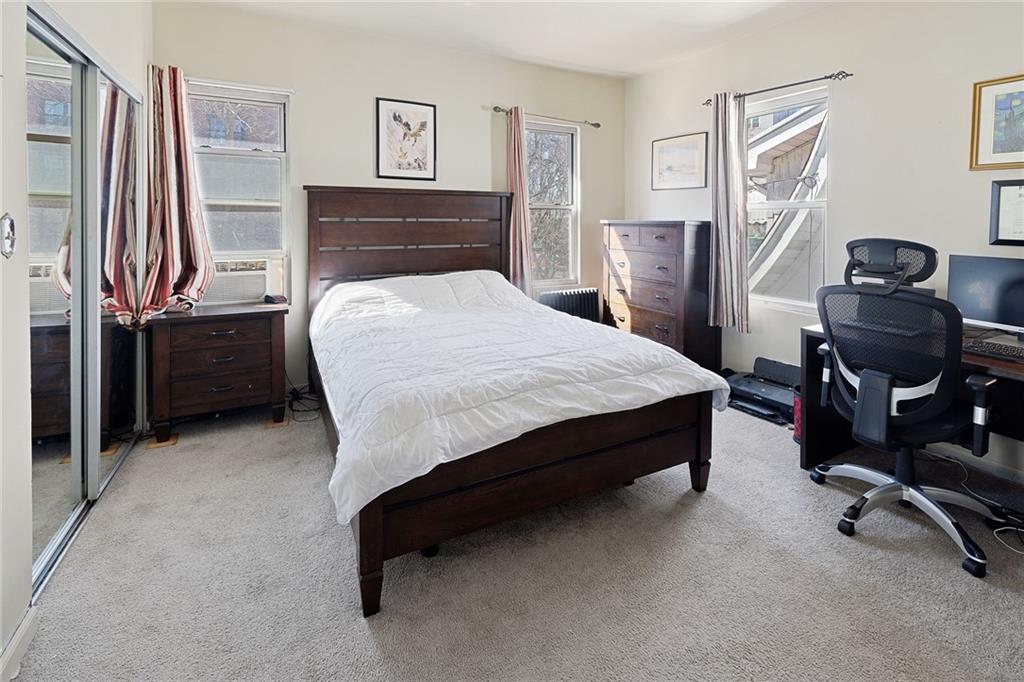 25 89th Street Brooklyn, NY 11209 - Photo 10 of 20 a bedroom with a bed next to a window