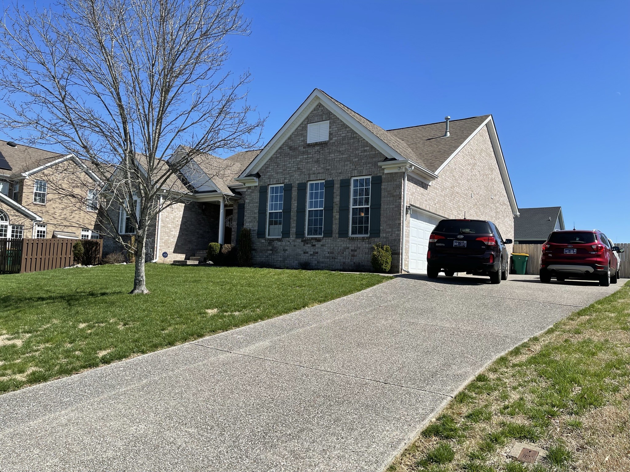 1003 Kyle Road Spring Hill, TN 37174 - Photo 3 of 24 a front view of a house with a yard