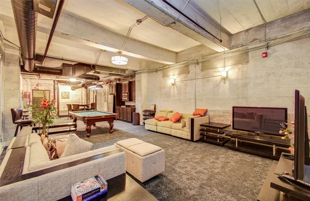 a living room with lots of furniture and a flat screen tv