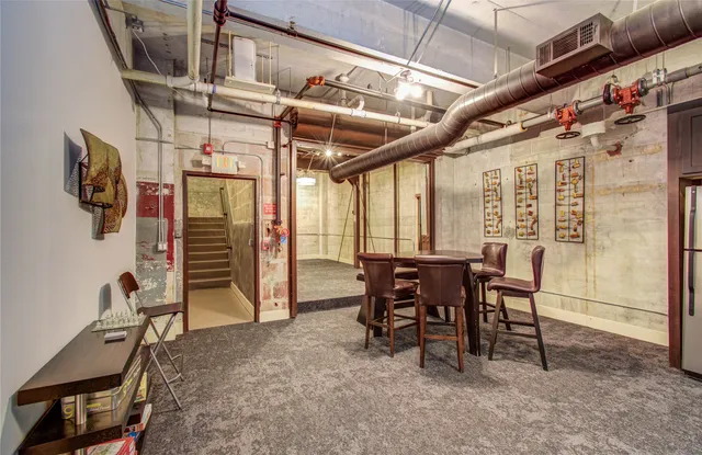 a view of a room with furniture and a window