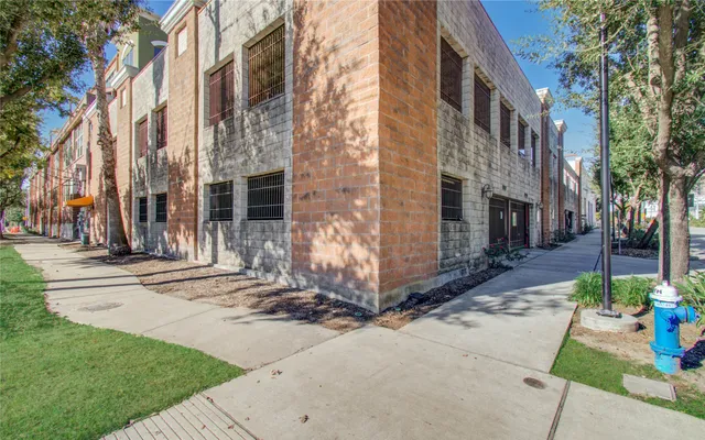 a front view of a building with garden