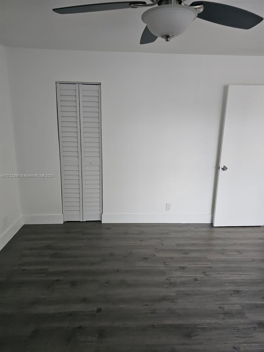 3777 Northwest 78th Avenue, Unit 3H Davie, FL 33024 - Photo 13 of 34 a view of an empty room with wooden floor