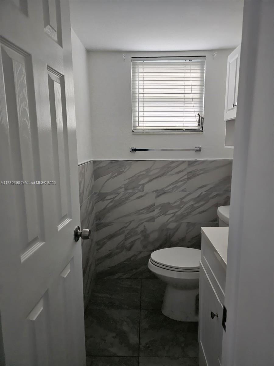 3777 Northwest 78th Avenue, Unit 3H Davie, FL 33024 - Photo 16 of 34 a bathroom with a toilet and a sink