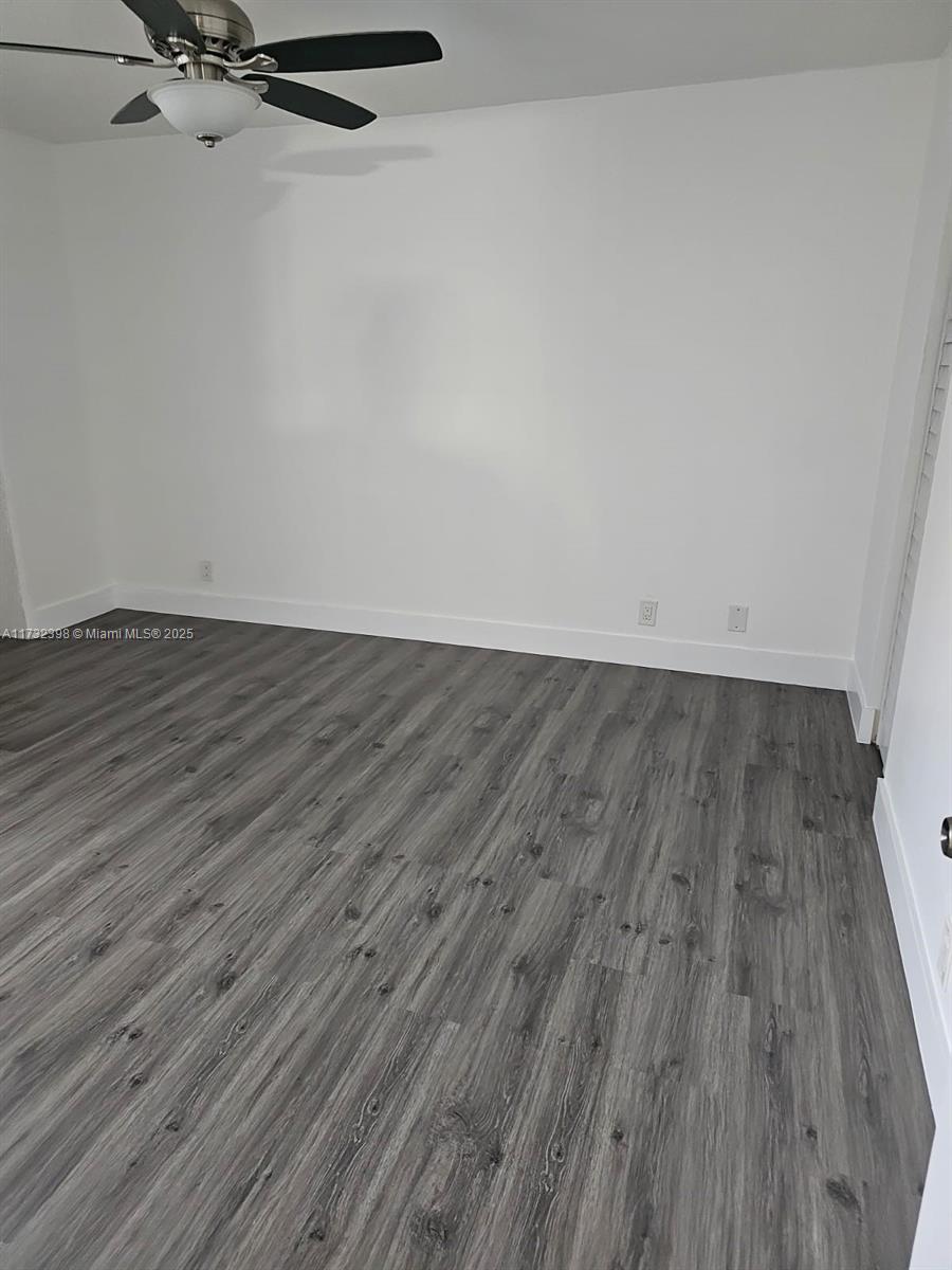 3777 Northwest 78th Avenue, Unit 3H Davie, FL 33024 - Photo 17 of 34 a view of a room with wooden floor