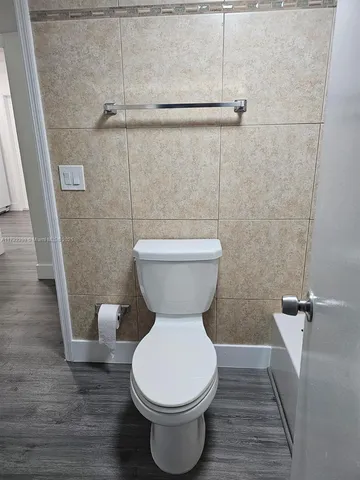 a bathroom with a toilet sink and a shower
