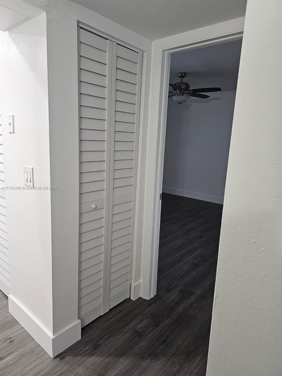 3777 Northwest 78th Avenue, Unit 3H Davie, FL 33024 - Photo 24 of 34 an empty room with wooden floor and closet