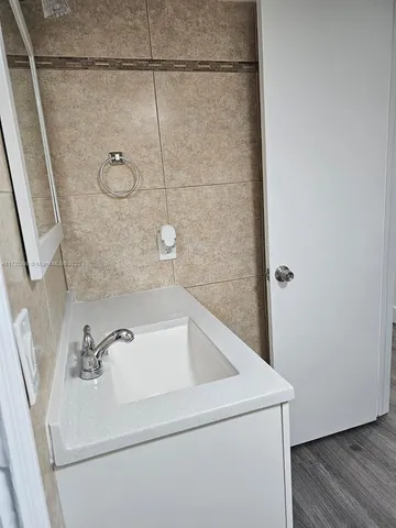 a bathroom with a sink and vanity