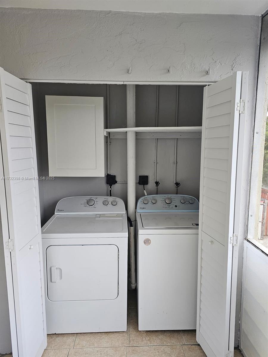 3777 Northwest 78th Avenue, Unit 3H Davie, FL 33024 - Photo 33 of 34 a utility room with dryer and washer
