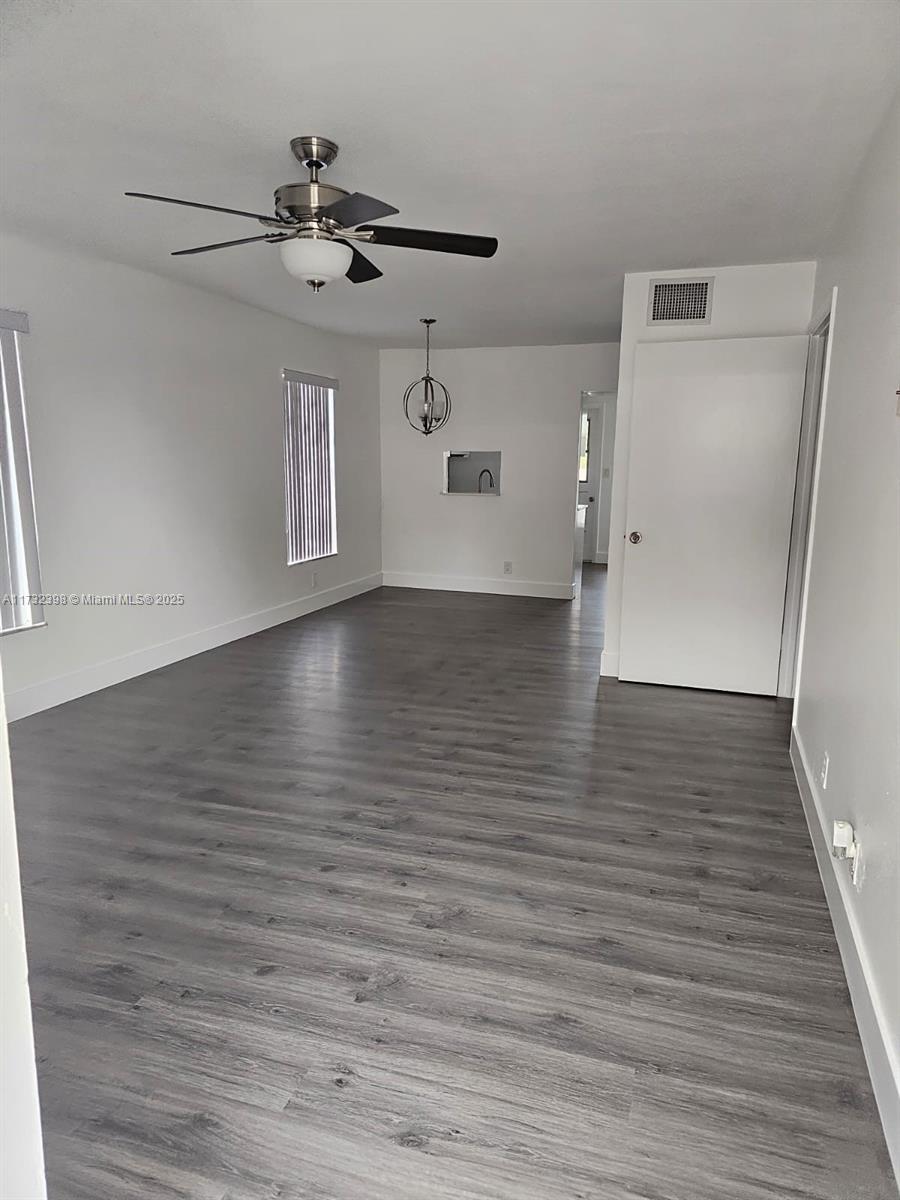 3777 Northwest 78th Avenue, Unit 3H Davie, FL 33024 - Photo 5 of 34 a view of a room with wooden floor