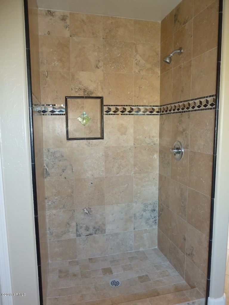 13651 West Calavar Road Surprise, AZ 85379 - Photo 21 of 29 Travertine and granite shower surround