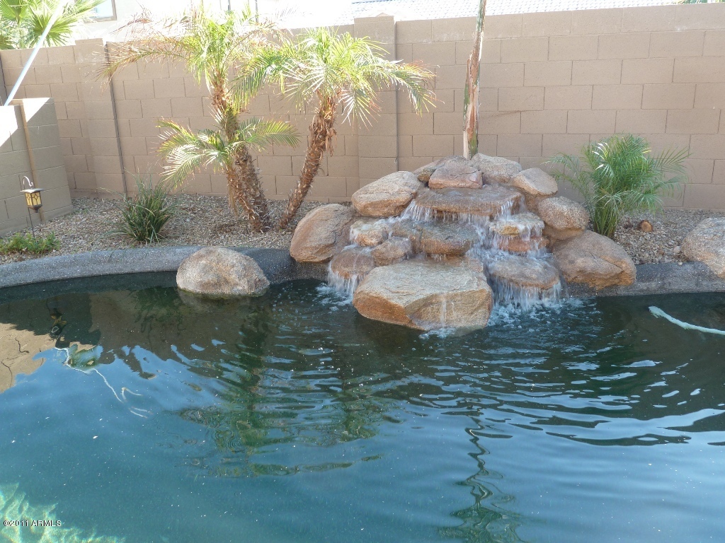 13651 West Calavar Road Surprise, AZ 85379 - Photo 5 of 29 Relaxing water fall in backyard pool