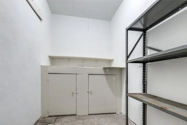 a view of storage and utility room with closet