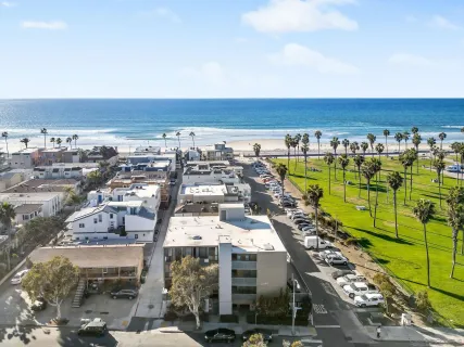 an aerial view of a large building with a yard