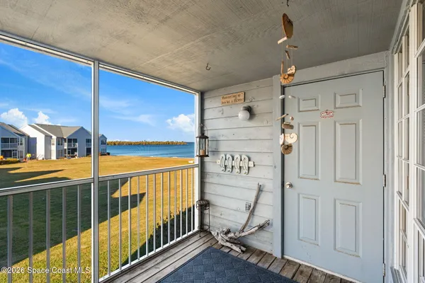 a view of a porch with wooden floor