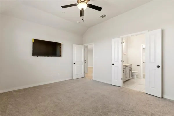 a view of a room with wooden floor and stairs
