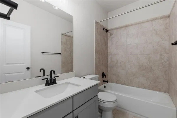 a kitchen with granite countertop a sink and cabinets