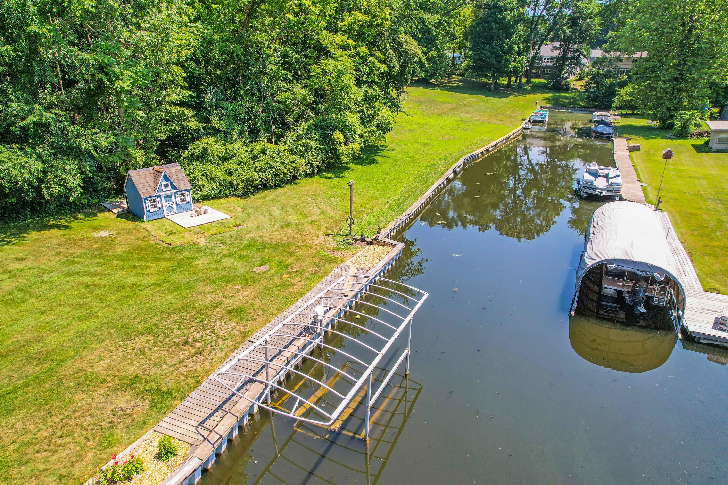 11176 Mcgregor Road Pinckney, MI 48169 - Photo 43 of 49 Boat Lift in Channel