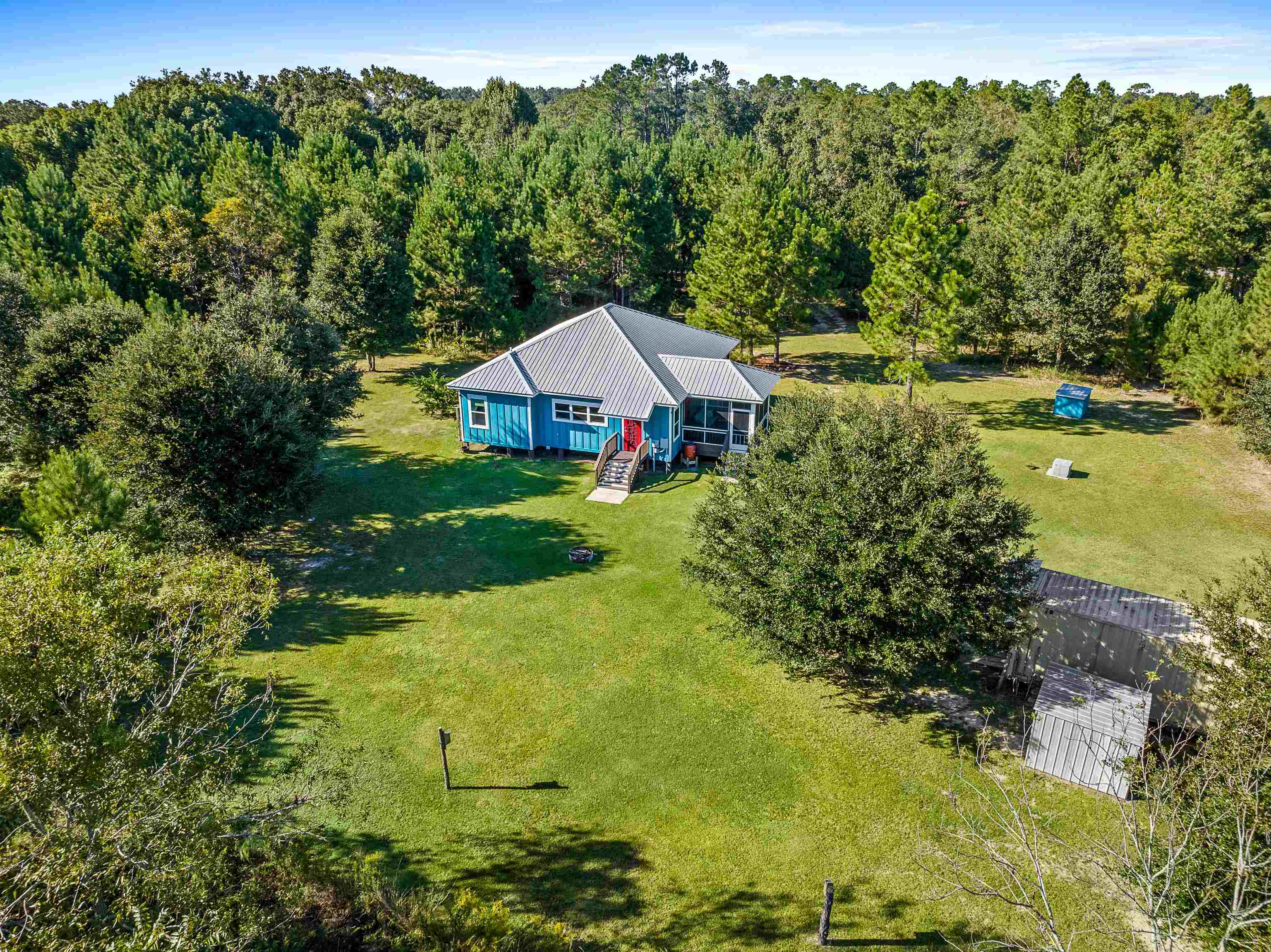 24616 Bretz Lane Elberta, AL 36530 - Photo 8 of 42 Drone view highlighting the home's private setting.