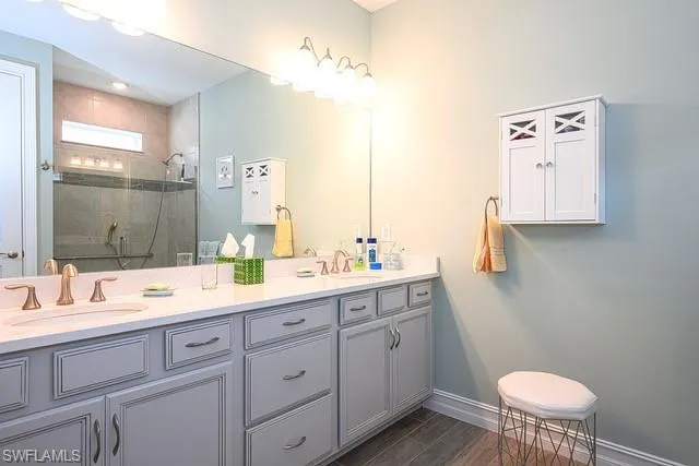 a bedroom with two bed and a window