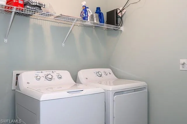 a view of a porch with chairs and backyard