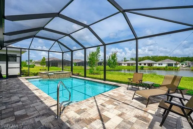 a view of swimming pool with a patio