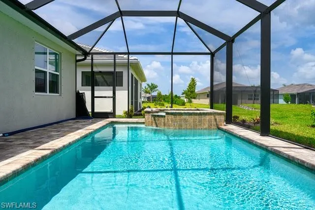 a front view of a house with a garden and pathway