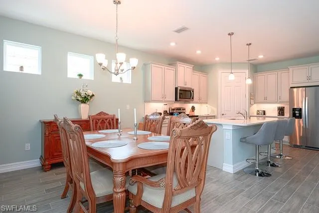 a view of a dining area with furniture window and wooden floor