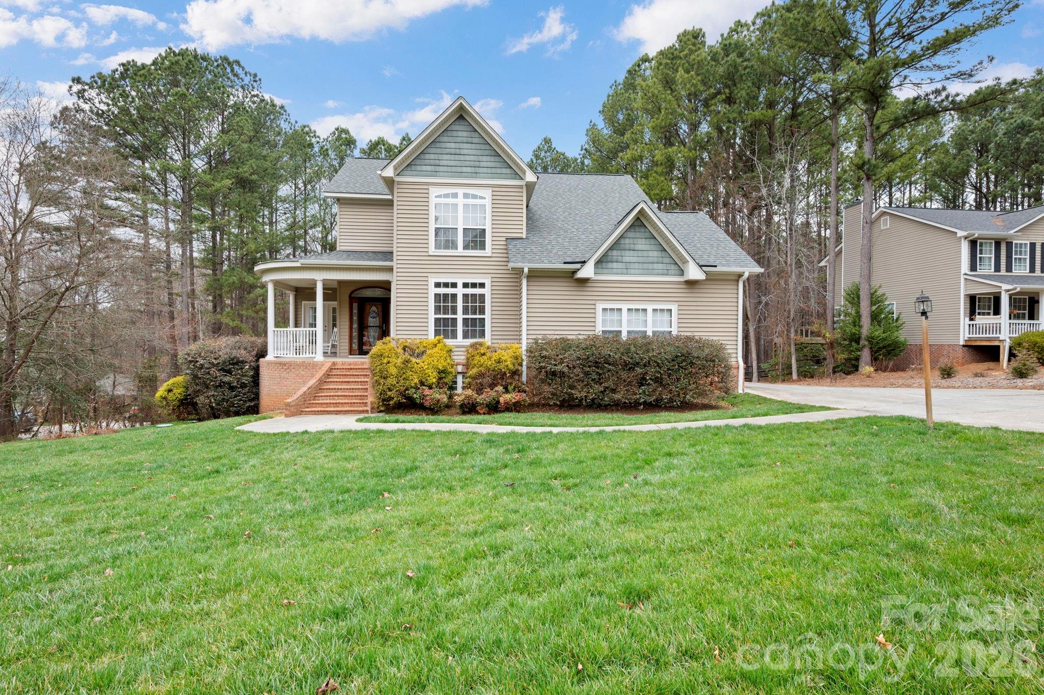 1606 High Ridge Drive Stanley, NC 28164 - Photo 2 of 43 front view of a house with a yard
