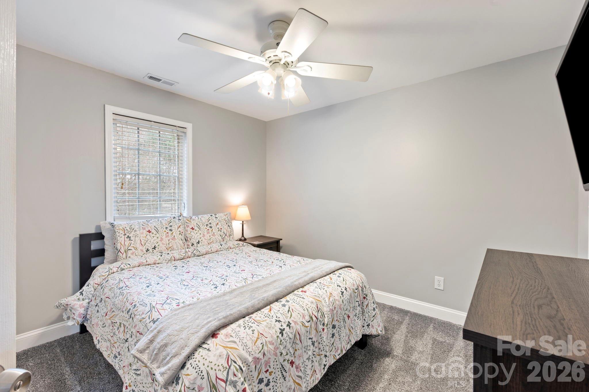 1606 High Ridge Drive Stanley, NC 28164 - Photo 30 of 43 a bedroom with a bed and a night stand