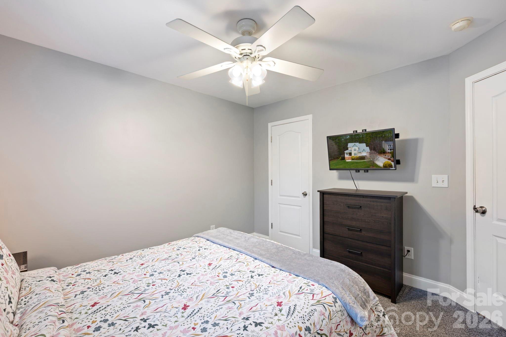 1606 High Ridge Drive Stanley, NC 28164 - Photo 31 of 43 a bedroom with a bed and a dresser