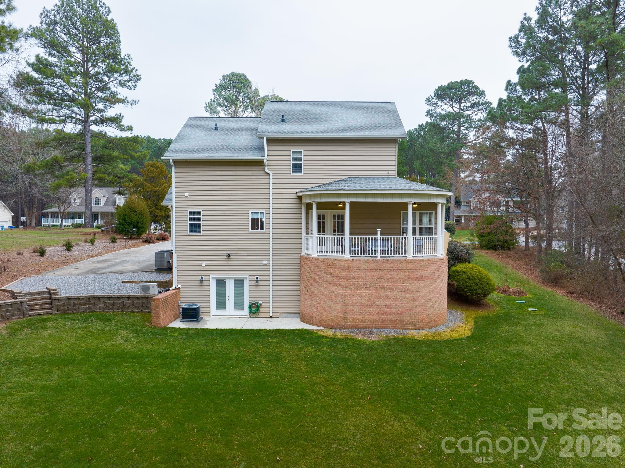 1606 High Ridge Drive Stanley, NC 28164 - Photo 35 of 43 a front view of a house with garden